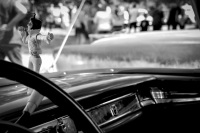 a little singing elvis puppet is hanging at the dashboard of an oldtimer at the oldtimermeeting in hermannsburg, black-and-white