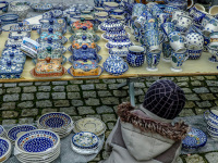 on a market in bergen in lower saxony a child is looking at bunzlau ceramics