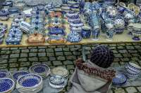 on a market in bergen in lower saxony a child is looking at bunzlau ceramics