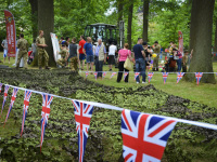 behind british pennants there are visitors of a british festivity in bergen in lower saxony