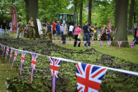 behind british pennants there are visitors of a british festivity in bergen in lower saxony