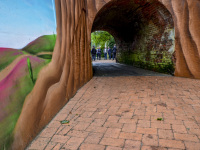 past a painting wall is a little tunnel where behind it a group of politicians is meeting on a inspection date in bergen