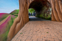 past a painting wall is a little tunnel where behind it a group of politicians is meeting on a inspection date in bergen