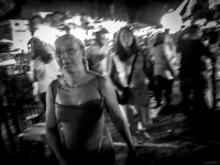 women are walking on the funfair in kremasti on rhodes by night, black-and-white