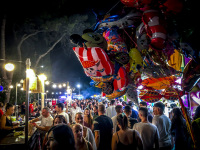 many colorful balloons and many people by night on the funfair in kremasti on rhodes