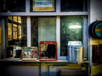 three mirriors are standing in front of a shop with antique stuff in the old town of ioannina