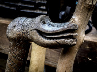 at the antique market in monastiraki in athens the knob of a wooden walking stick shows a carved crocodile head
