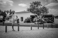 three completely different men at the thiseio station in athens, black-and-white
