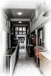 in a house passage in monastiraki in athens are standing antique wooden furniture for sale