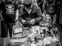 an old street vendor with his sales cart in a street in monastiraki in athens, black-and-white