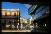 guests are leaving the acropolis museum in athens at a loveley evening light and a blue sky