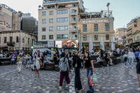 young people in a evening light on the monastiraki square in athens