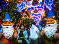 people are walking in the fairy tale street of the restaurant little kook in monastiraki in athens