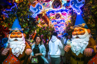 people are walking in the fairy tale street of the restaurant little kook in monastiraki in athens