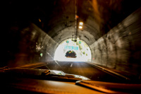 view out of a jeep wrangler in a tunnel near metsovo with light at the end of the tunnel
