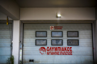 a garage door where is red lettering olympiakos nautical facilities