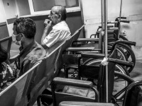 waiting people and some wheelchairs in the hospital of aegio in greece, black-and-white