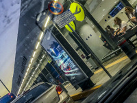 view through a windshield to the entrance of the airport rhodes at evening light