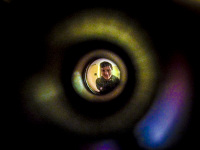you see a young man through the door viewer in the hotel XII apostel in cologne in germany
