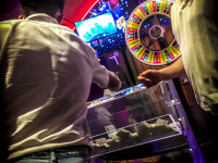 Young men at a tombola box in the casino rodos in rhodes city