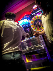 Young men at a tombola box in the casino rodos in rhodes city