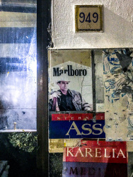 signs of advertising for cigarettes marlboro, karelia and assos in front of the restaurant mavrios in archangelos on rhodes