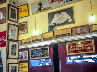 in the tavern barbadimos in piraeus with vintage decoration and a cook who is looking out of the kitchen