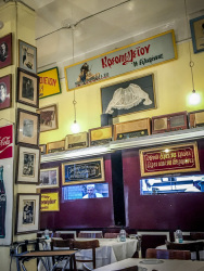 in the tavern barbadimos in piraeus with vintage decoration and a cook who is looking out of the kitchen