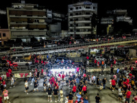 many fans of fc olympiakos piraeus are passing the street in front of the karaikakis stadion after a football match