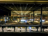 the illuminated front of the airport in berlin BER by night