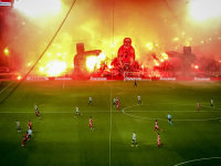 a football match at the fc olypmiakos stadion karaikakis in piraeus with pyrotechnics in the fan platform