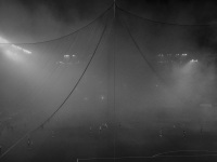 through a big net you see a match of the fc olympiakos piraeus in the karaikakis stadion, black-and-white