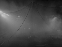 through a big net you see a match of the fc olympiakos piraeus in the karaikakis stadion, black-and-white