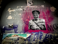 on a wall in ioannina are graffiti and posters inter alia kyriakos mitsotakis as a caricature