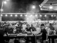 a busy funfair stand with suflaki in kremasti on rhodes, black-and-white