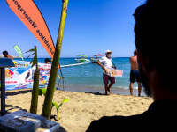 view from a nice shaded place to the watersport at tsambika beach on rhodes and on a seller of fresh donuts