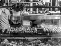 skewers of suflaki on a funfair in kremasti on rhodes, black-and-white