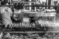 skewers of suflaki on a funfair in kremasti on rhodes, black-and-white