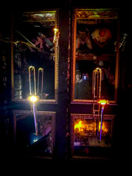 at the ceiling of the papa joe\'s jazzlokal in cologne are hanging trumpets and mirrors