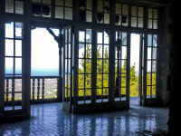 the old veranda of the mussolini villa in profitis ilias on rhodes, with backlit and a view into nature