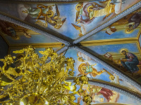the colorful dome of the church in ialysos on rhodes with a golden chandelier