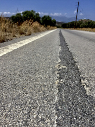 an old lonely street in a landscpae on rhodes is prepared with dsl