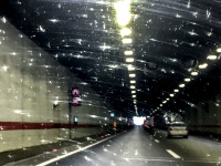 driving through a tunnel near belgrade in serbia with fly shit on the windscreen