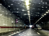 driving through a tunnel near belgrade in serbia with fly shit on the windscreen