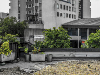 the terrace of the hotel esprit in bratislava in slovakia with green trees between grey houses