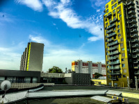 view out of the window of the hotel esprit in bratislava in slovakia to high-rise-buildings and the blue sky