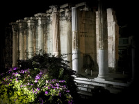 the illuminated columns of the hadrian\'s library in athens by night