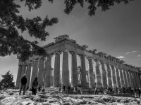 on a sunny day tourist are looking at the parthenon on the acropolis in athens, black-and-white