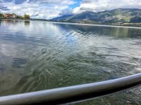 view from a railing to the lake pamvotida and the mountains in ioannina