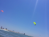 very close standing at the sea in prasonisi on rhodes you see in the distance kitesurfer at the beach